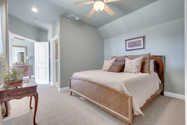 bedroom featuring vaulted ceiling, light colored carpet, and ceiling fan