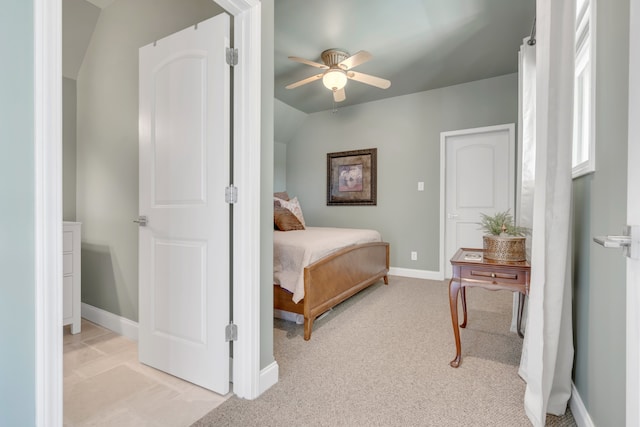 carpeted bedroom featuring ceiling fan and lofted ceiling