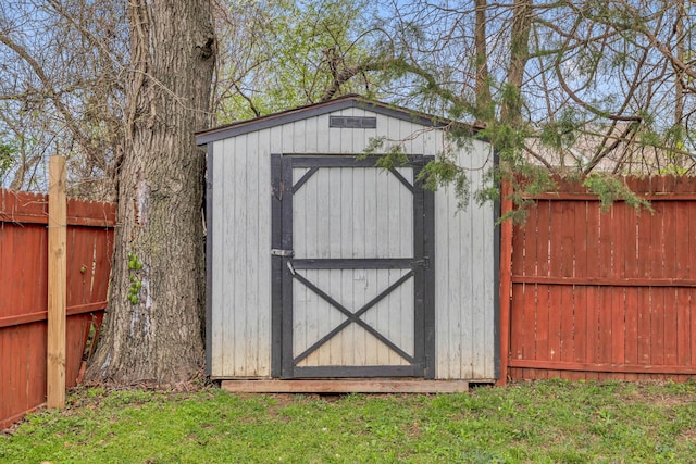 view of outdoor structure featuring a lawn