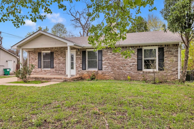 ranch-style home with a front lawn