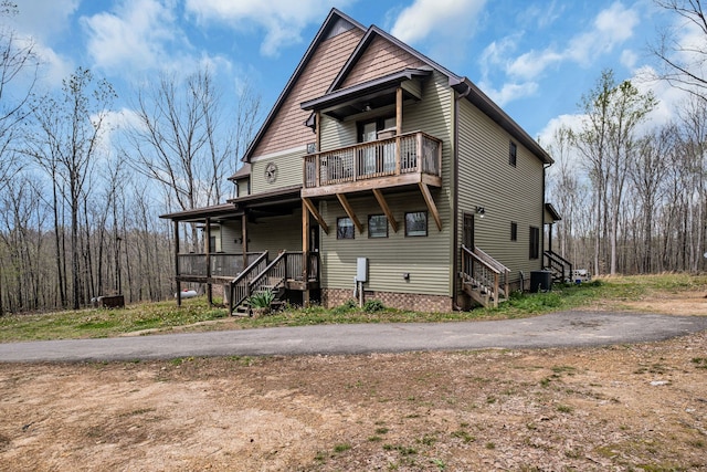 rear view of property featuring central air condition unit