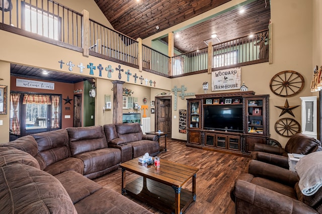 living room with high vaulted ceiling, wood ceiling, dark wood-type flooring, and ornate columns