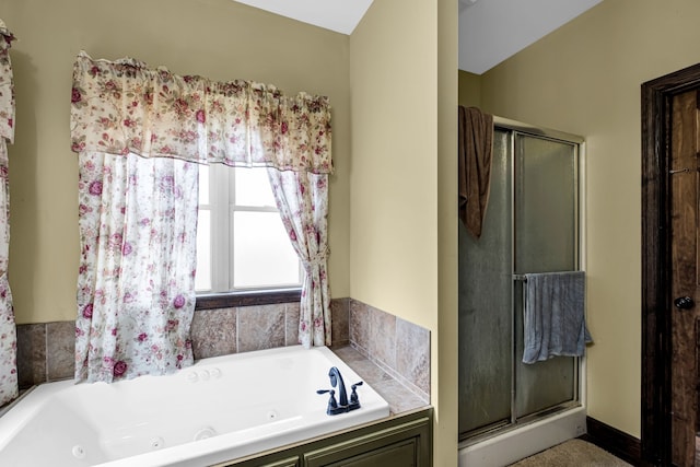 bathroom featuring separate shower and tub