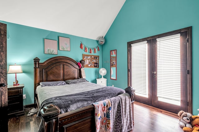 bedroom with high vaulted ceiling, wood-type flooring, and multiple windows