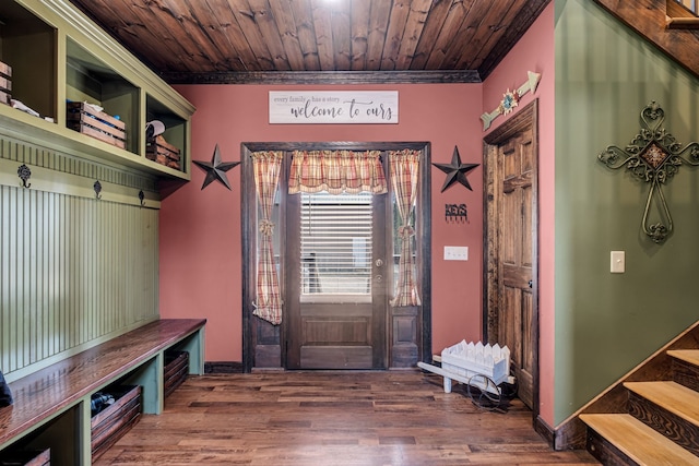 mudroom featuring dark hardwood / wood-style flooring, wooden ceiling, and ornamental molding