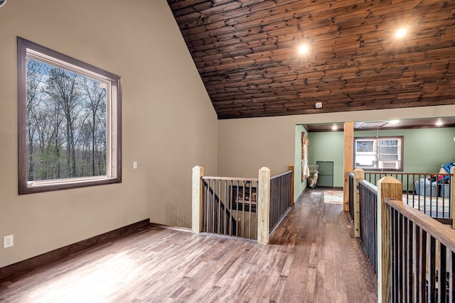 corridor featuring lofted ceiling and dark hardwood / wood-style floors