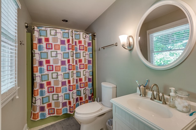 bathroom featuring toilet and vanity