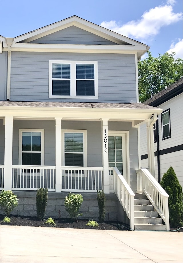 view of front of property featuring covered porch