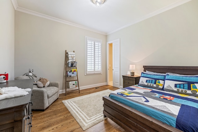 bedroom featuring dark wood-type flooring and ornamental molding