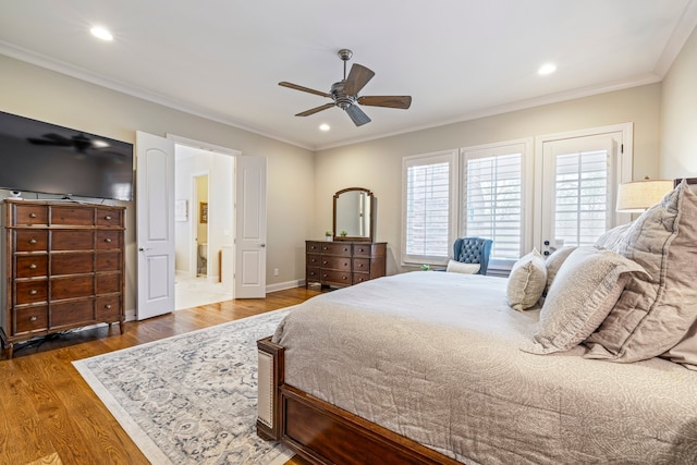 bedroom with dark hardwood / wood-style flooring, ceiling fan, and multiple windows