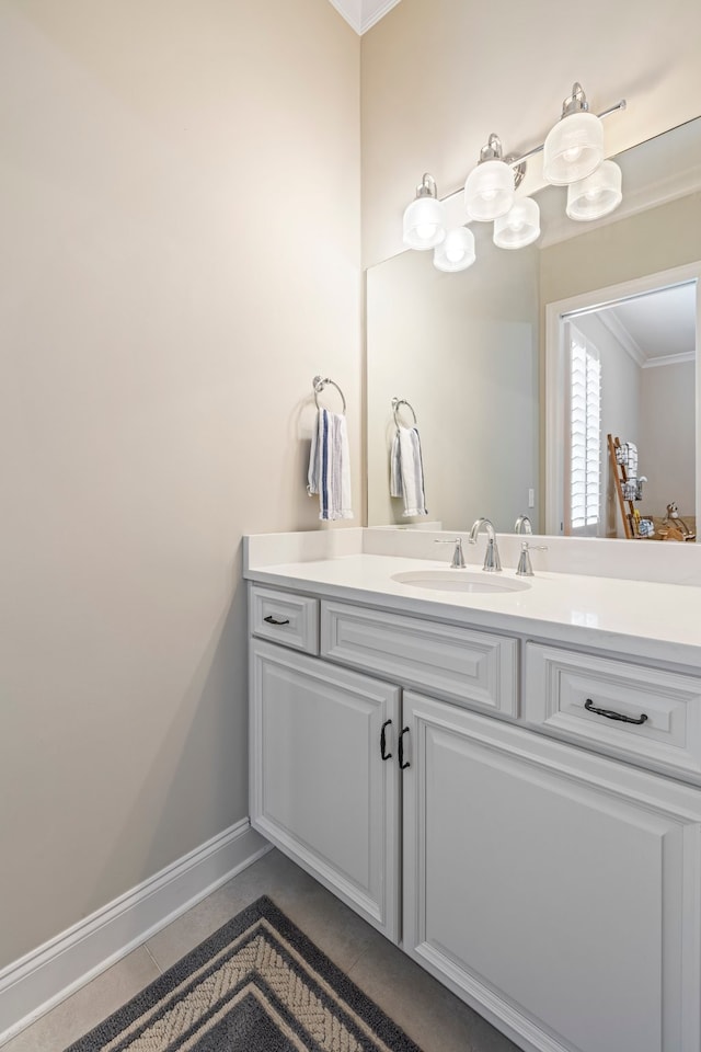 bathroom featuring tile floors, ornamental molding, and vanity