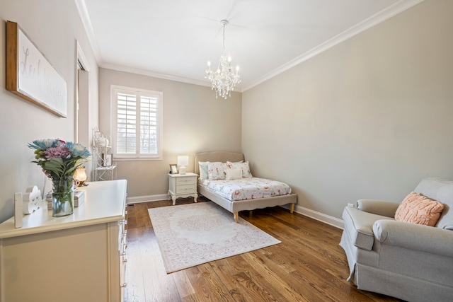 bedroom with a notable chandelier, ornamental molding, and hardwood / wood-style flooring