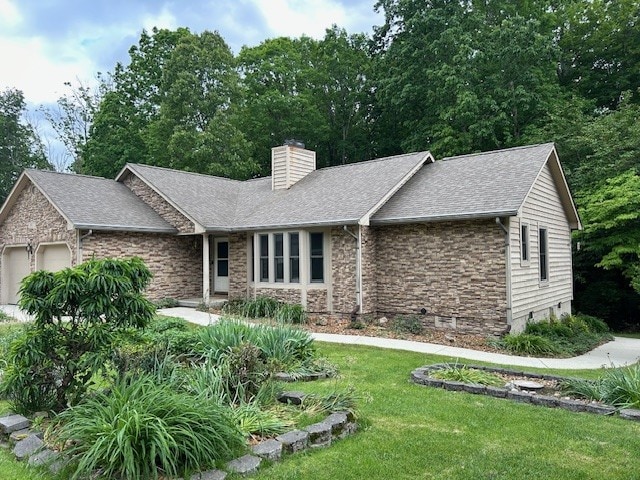 ranch-style house with a garage and a front lawn