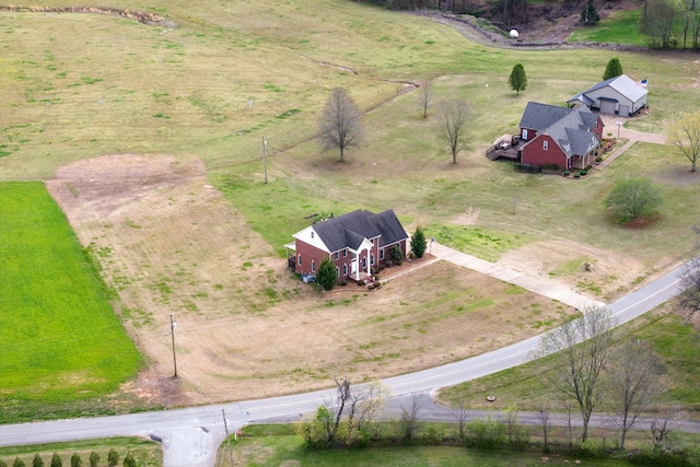 birds eye view of property featuring a rural view