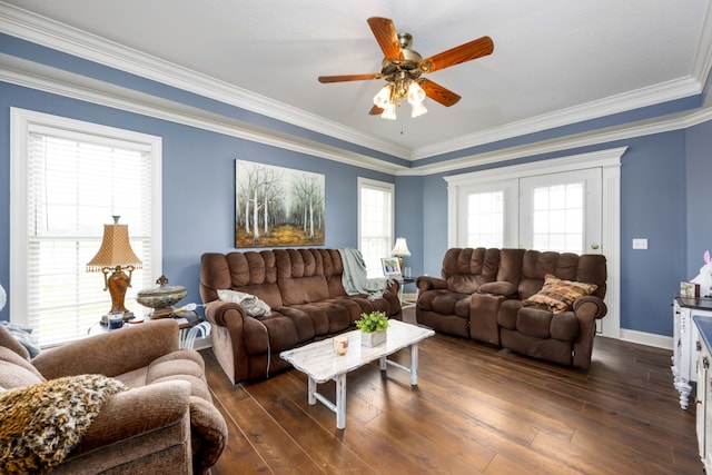 living room with ceiling fan, crown molding, dark hardwood / wood-style floors, and plenty of natural light