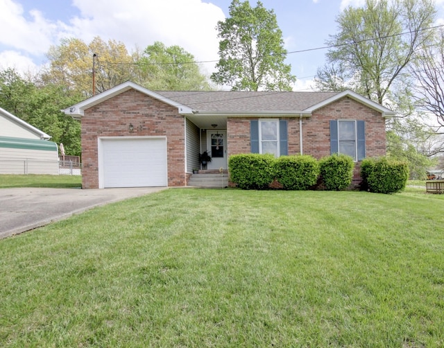 single story home with a garage and a front lawn