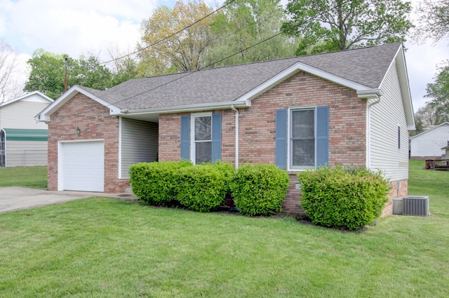 ranch-style house with a front yard, central AC unit, and a garage