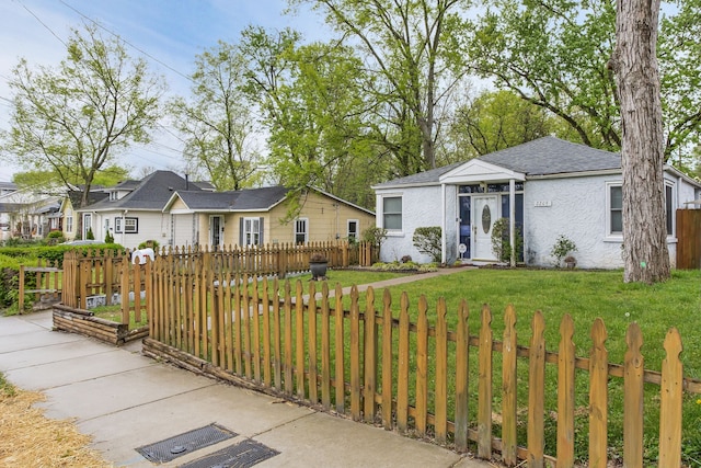 ranch-style home with a front yard