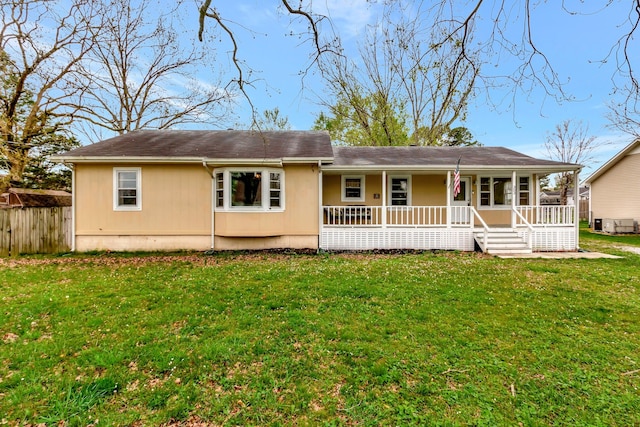 view of front of home with a porch and a front lawn