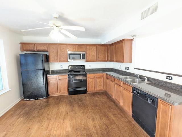 kitchen with sink, ceiling fan, light wood-type flooring, and black appliances