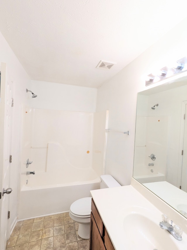 full bathroom featuring vanity with extensive cabinet space, toilet, tile floors, and shower / bathtub combination