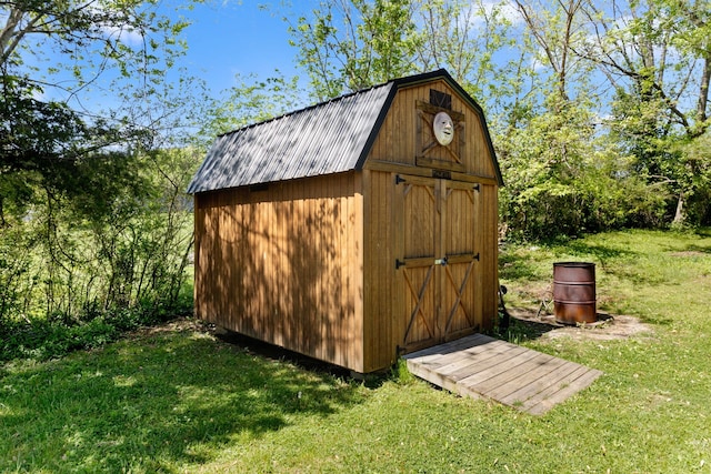 view of outdoor structure with a lawn