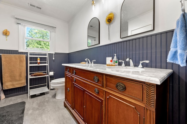 bathroom featuring toilet and vanity