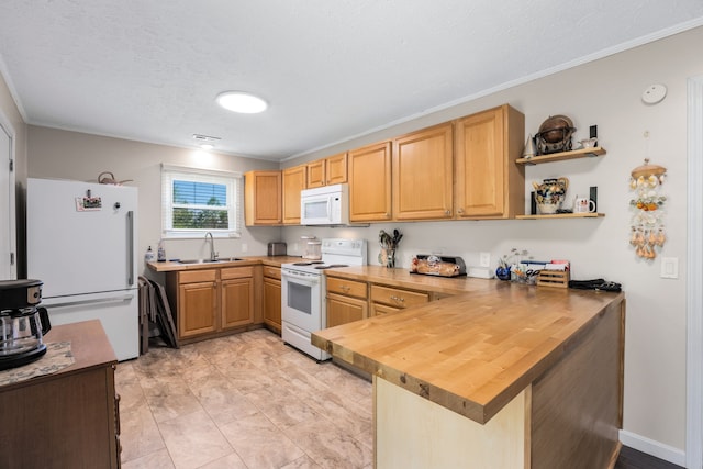 kitchen featuring light tile floors, sink, white appliances, ornamental molding, and kitchen peninsula