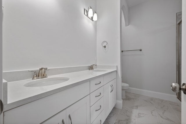 bathroom with vanity and toilet