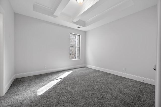 spare room featuring beam ceiling and carpet flooring