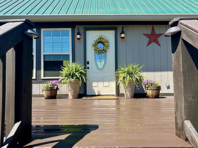 entrance to property featuring a deck