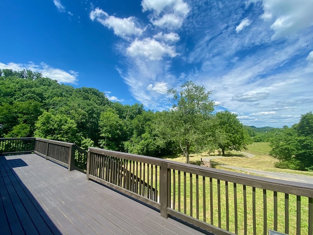 wooden deck with a yard