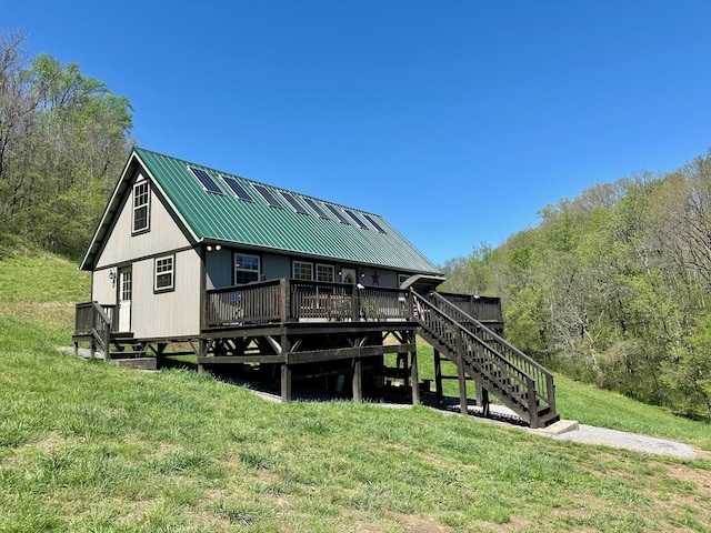 dock area with a yard and a deck