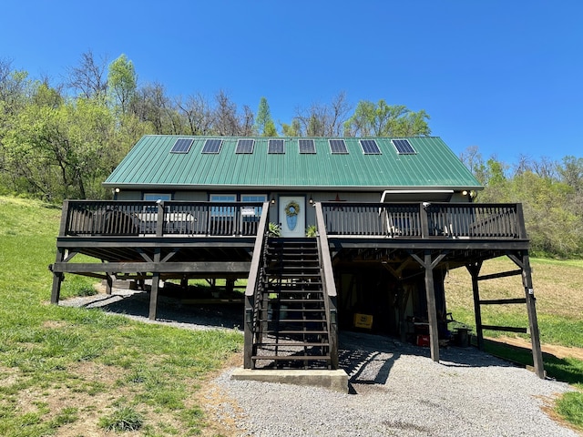 view of nearby features featuring a wooden deck and a lawn