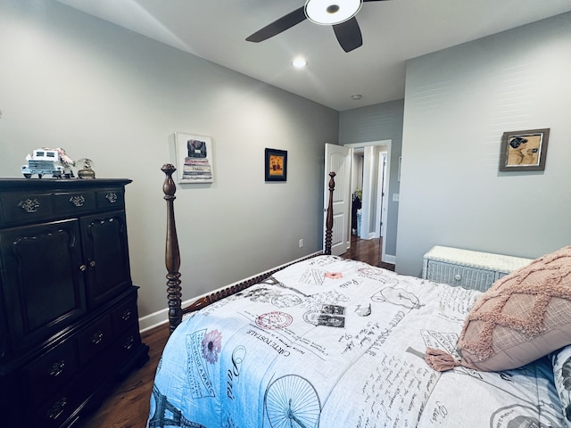 bedroom featuring ceiling fan and dark hardwood / wood-style floors