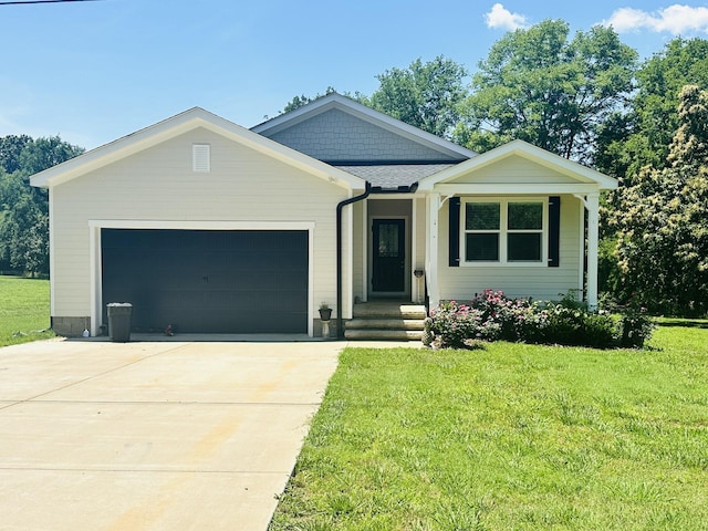 view of front of home with a garage and a front yard