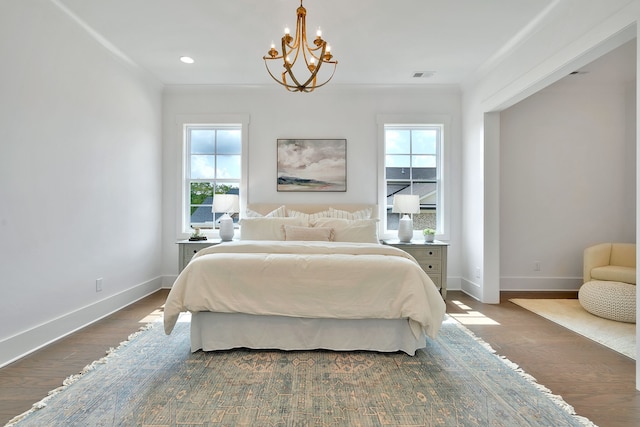 bedroom featuring dark hardwood / wood-style flooring and a notable chandelier