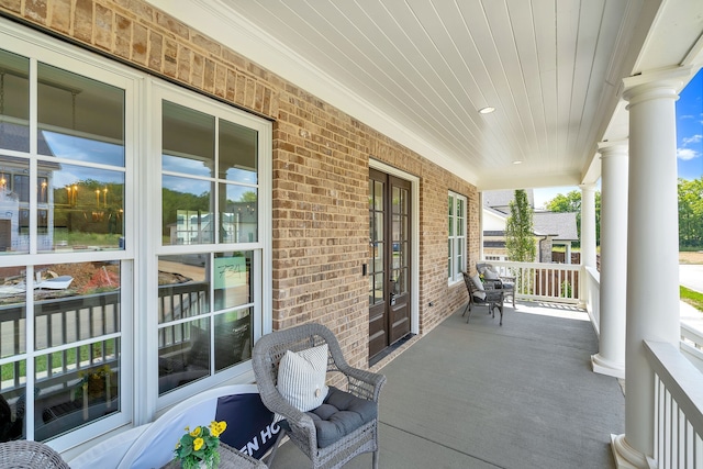 view of terrace featuring covered porch