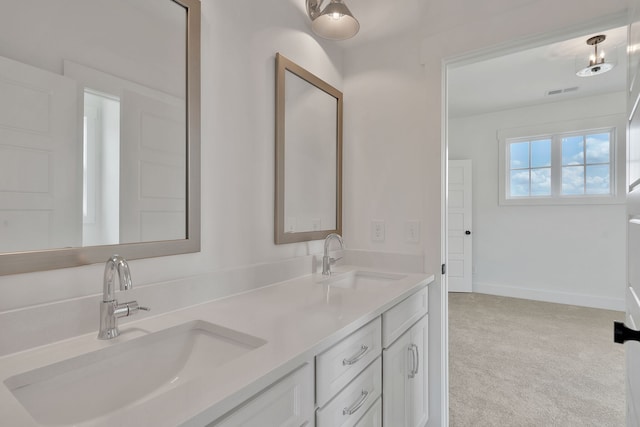 bathroom featuring dual bowl vanity