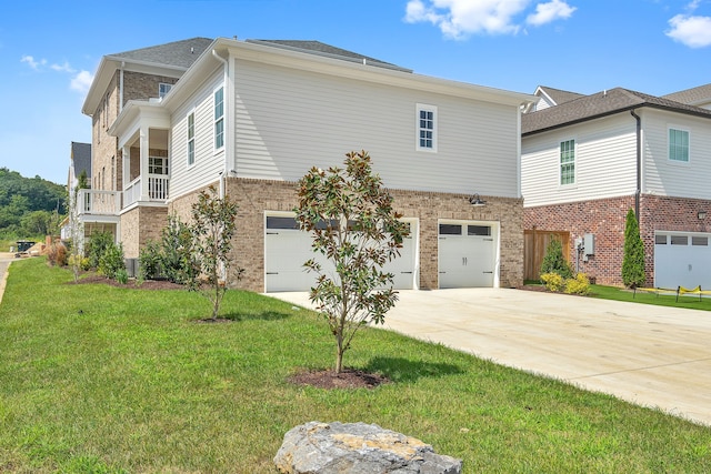 view of front of home with a garage and a front lawn