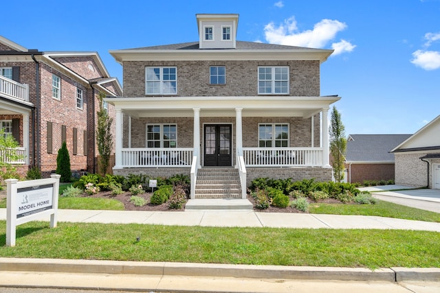 view of front of house featuring a porch and a front yard