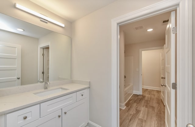 bathroom featuring vanity and hardwood / wood-style floors