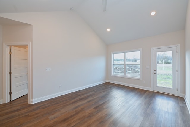 unfurnished room featuring dark hardwood / wood-style flooring and high vaulted ceiling