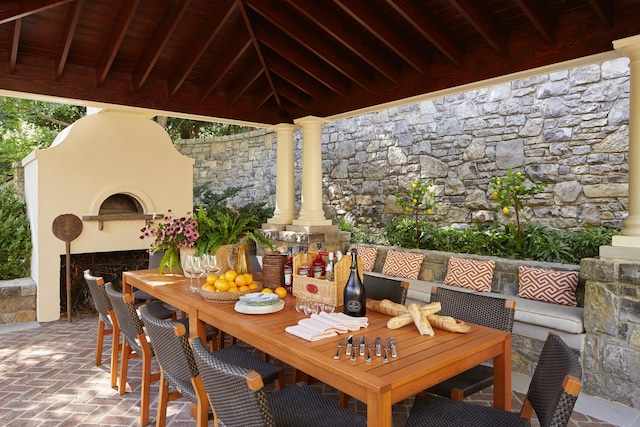 view of patio / terrace featuring exterior fireplace