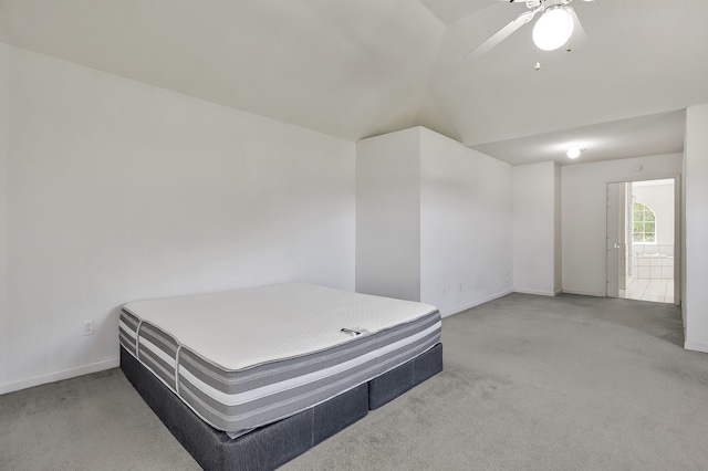 carpeted bedroom featuring ceiling fan and lofted ceiling