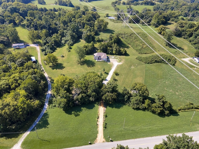 birds eye view of property with a rural view