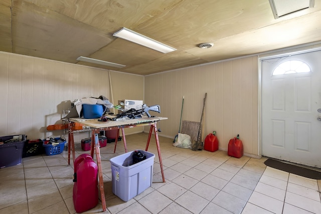 basement featuring light tile patterned floors