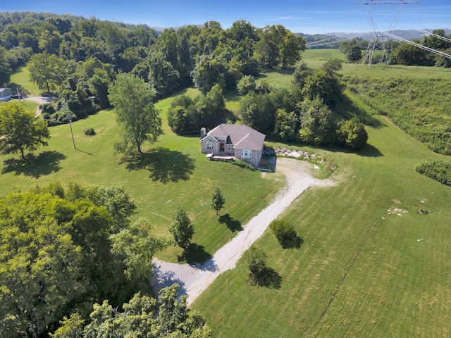 birds eye view of property with a rural view