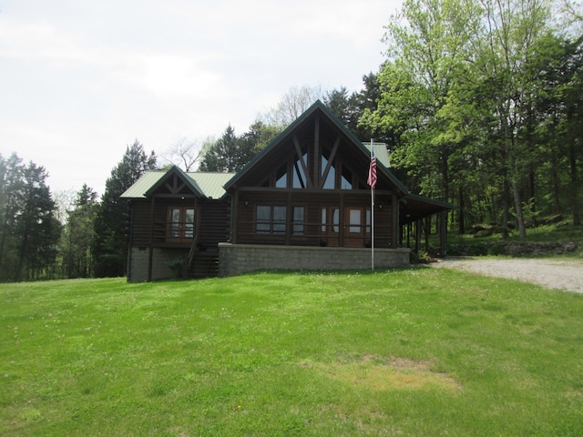 rear view of property featuring a yard