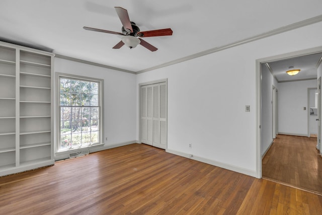 spare room with ornamental molding, ceiling fan, and hardwood / wood-style flooring